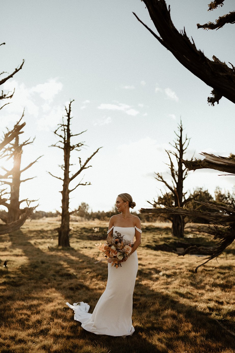 central oregon outdoor wedding venues with the bride posing at juniper preserve